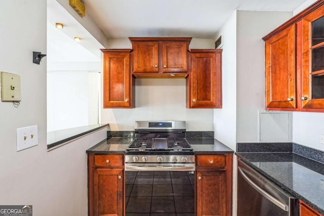 620 Peachtree St NE Unit 1413, Atlanta, GA 30308 - kitchen featuring appliances with stainless steel finishes and dark stone countertops