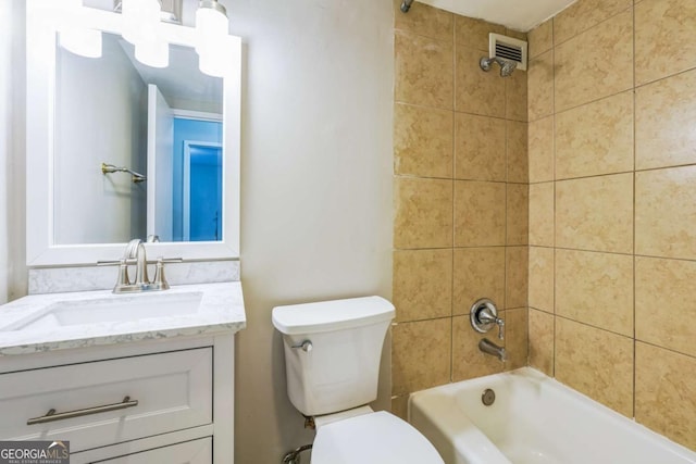 620 Peachtree St NE Unit 1413, Atlanta, GA 30308 - bathroom with visible vents, toilet, vanity, and shower / bathtub combination
