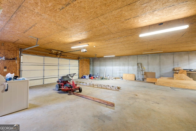 224 Buckshot Ln, Tiger, GA 30576 - garage featuring a garage door opener and washer / clothes dryer