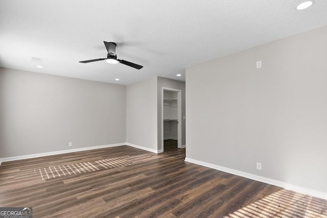 unfurnished room featuring dark wood finished floors, baseboards, ceiling fan, and recessed lighting