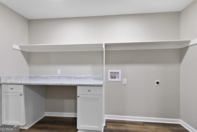 washroom with hookup for a washing machine, electric dryer hookup, baseboards, cabinet space, and dark wood-style flooring