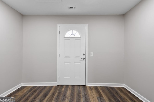 entryway featuring baseboards, visible vents, and dark wood-style flooring