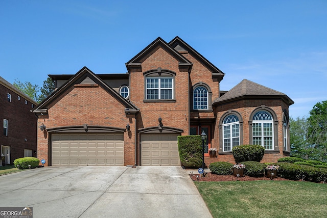 view of front of house featuring concrete driveway, an attached garage, brick siding, and a front lawn