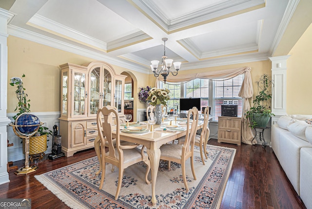 dining area with ornate columns, a chandelier, ornamental molding, and dark wood finished floors