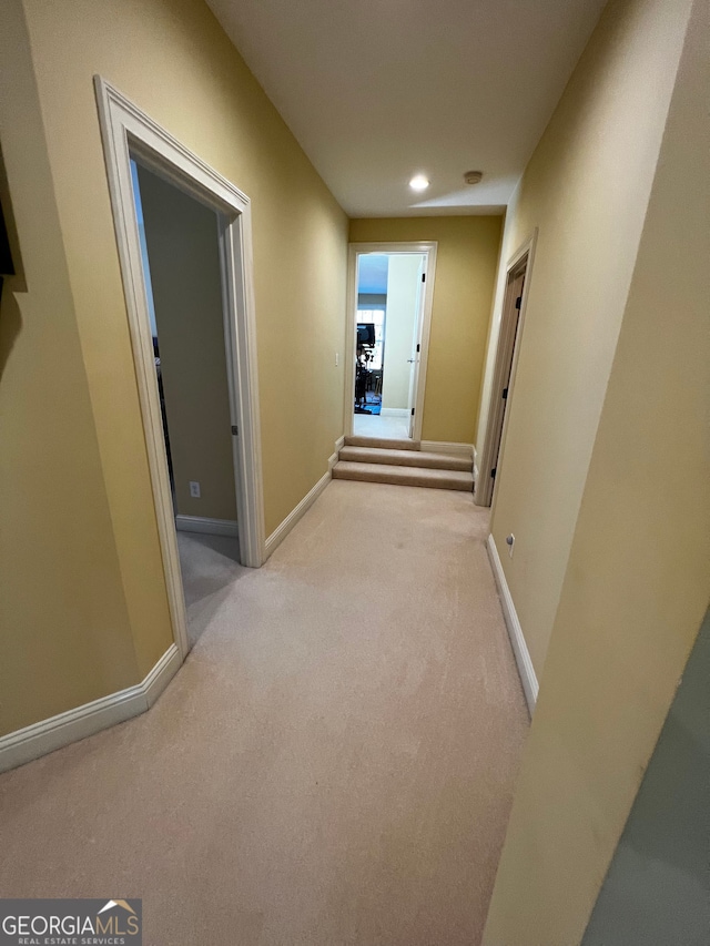 hall with recessed lighting, carpet flooring, and baseboards