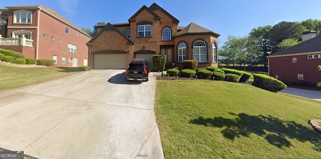 traditional home featuring concrete driveway, brick siding, and a front yard