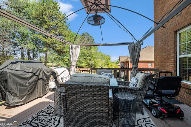 deck featuring outdoor dining area and a grill
