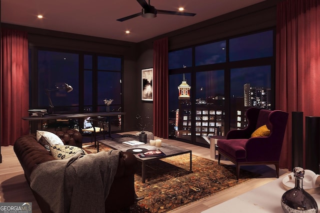 interior space with wood finished floors and ceiling fan