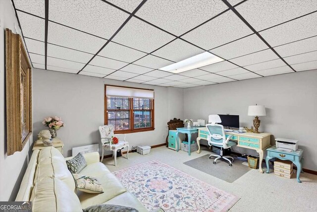 home office featuring baseboards, carpet flooring, and a drop ceiling