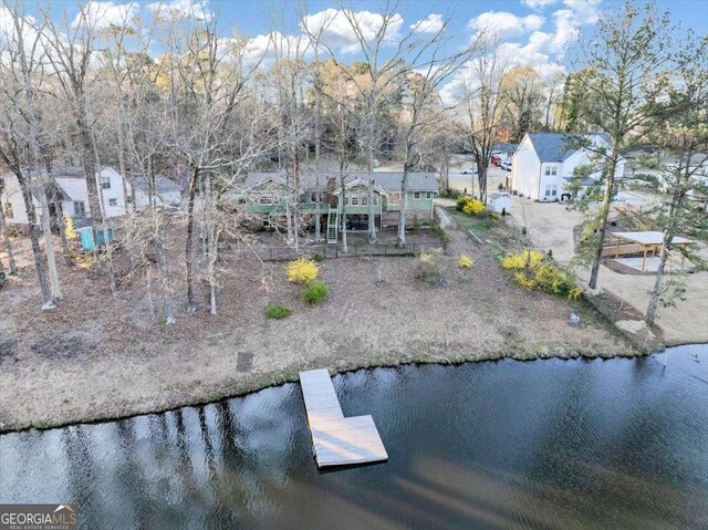 drone / aerial view with a residential view and a water view