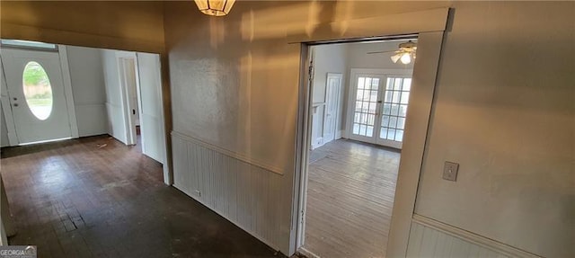 807 Elizabeth St, Waycross, GA 31503 - hallway featuring dark wood finished floors and wainscoting
