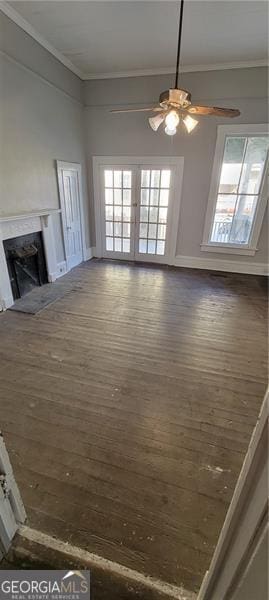 807 Elizabeth St, Waycross, GA 31503 - unfurnished living room featuring crown molding, a high end fireplace, a ceiling fan, and wood-type flooring