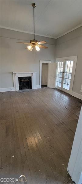 807 Elizabeth St, Waycross, GA 31503 - unfurnished living room featuring crown molding, baseboards, a fireplace, a ceiling fan, and wood-type flooring