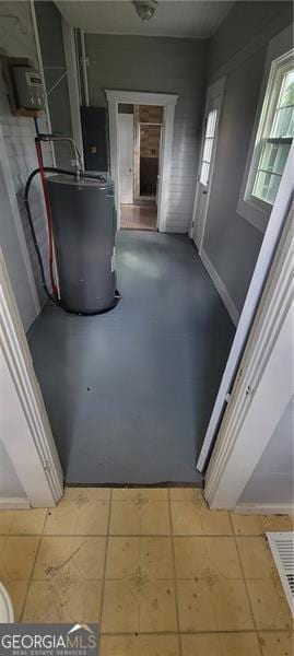 807 Elizabeth St, Waycross, GA 31503 - corridor with water heater and tile patterned flooring