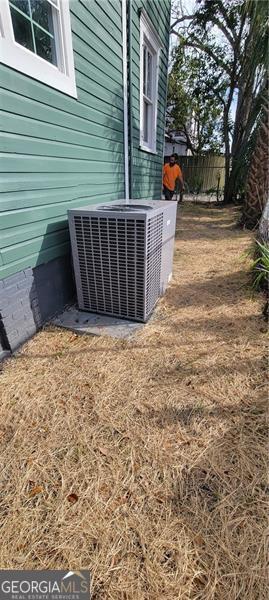 807 Elizabeth St, Waycross, GA 31503 - details featuring fence, cooling unit, and crawl space