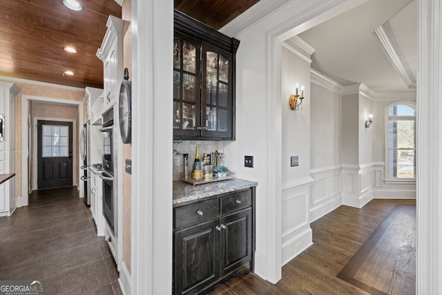 3491 Falls Branch Ct, Buford, GA 30519 - bar with ornamental molding, healthy amount of natural light, recessed lighting, appliances with stainless steel finishes, and dark wood finished floors