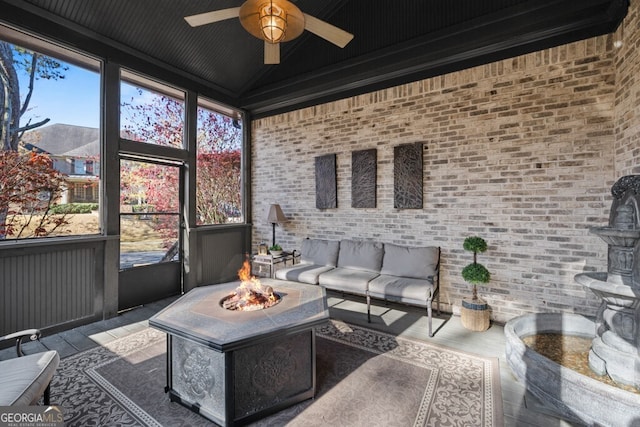 3491 Falls Branch Ct, Buford, GA 30519 - sunroom with ceiling fan and an outdoor living space with a fire pit