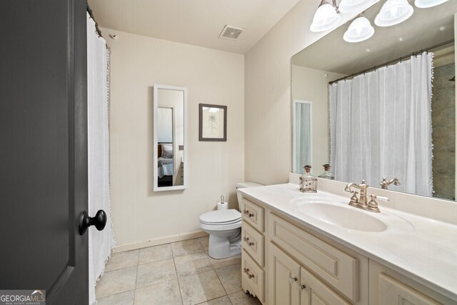 3491 Falls Branch Ct, Buford, GA 30519 - bathroom with vanity, toilet, tile patterned flooring, and baseboards