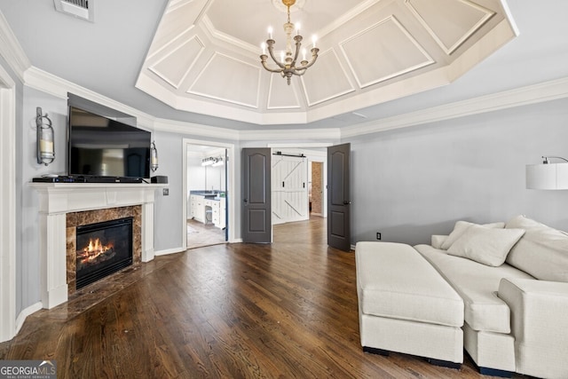 3491 Falls Branch Ct, Buford, GA 30519 - living area with a chandelier, a premium fireplace, crown molding, wood finished floors, and baseboards