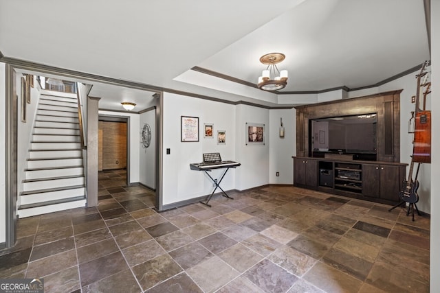 3491 Falls Branch Ct, Buford, GA 30519 - living room with stone tile floors, baseboards, crown molding, stairs, and a chandelier