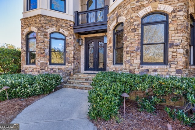 3491 Falls Branch Ct, Buford, GA 30519 - doorway to property with a balcony, stone siding, and french doors