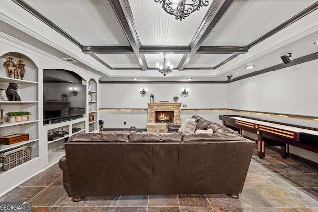 3491 Falls Branch Ct, Buford, GA 30519 - living area featuring crown molding, a chandelier, coffered ceiling, stone tile flooring, and a stone fireplace