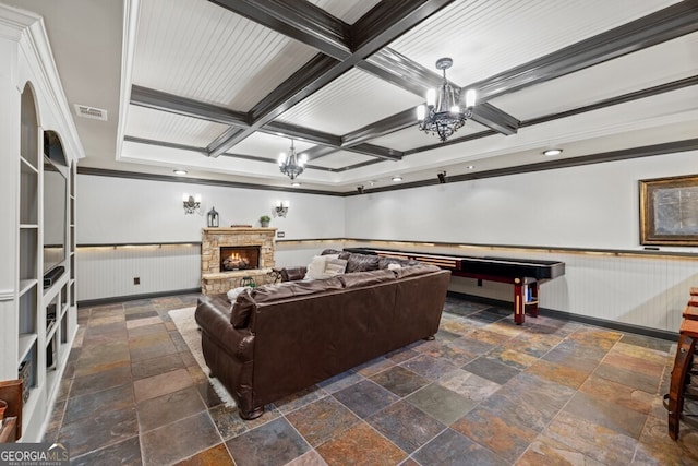 3491 Falls Branch Ct, Buford, GA 30519 - living area with ornamental molding, wainscoting, stone tile flooring, a chandelier, and coffered ceiling