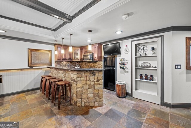 3491 Falls Branch Ct, Buford, GA 30519 - bar with stainless steel microwave, crown molding, stone tile floors, freestanding refrigerator, and decorative backsplash