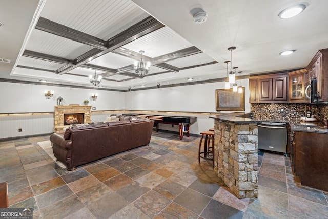 3491 Falls Branch Ct, Buford, GA 30519 - living area featuring stone tile floors, beam ceiling, ornamental molding, coffered ceiling, and a stone fireplace