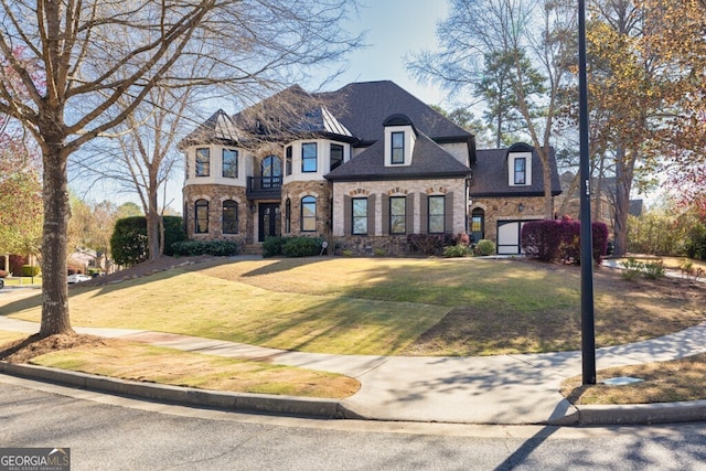 3491 Falls Branch Ct, Buford, GA 30519 - french country style house featuring stone siding and a front lawn