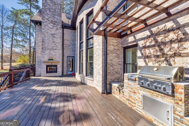 3491 Falls Branch Ct, Buford, GA 30519 - deck featuring grilling area, exterior kitchen, and a pergola