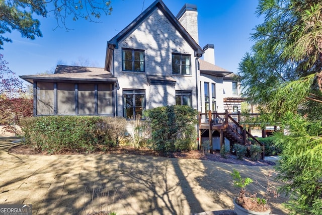 3491 Falls Branch Ct, Buford, GA 30519 - rear view of property with a chimney, stairs, a deck, and brick siding