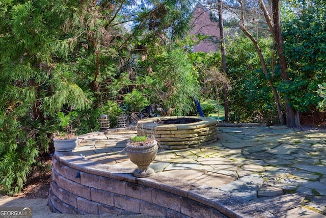 3491 Falls Branch Ct, Buford, GA 30519 - view of patio featuring a fire pit