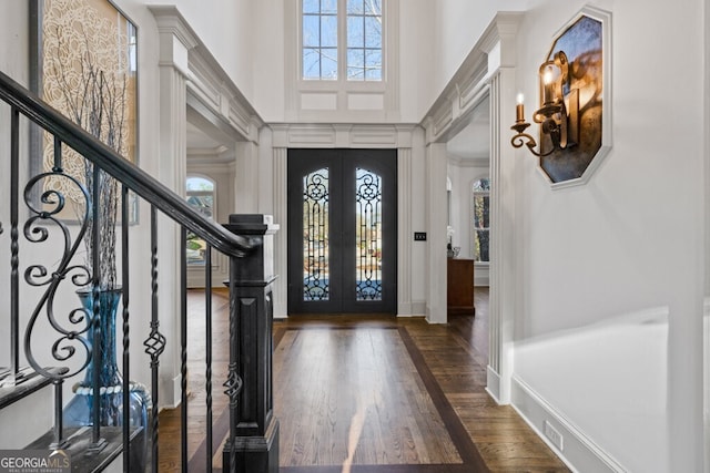 3491 Falls Branch Ct, Buford, GA 30519 - entrance foyer featuring french doors, wood finished floors, a high ceiling, stairs, and baseboards
