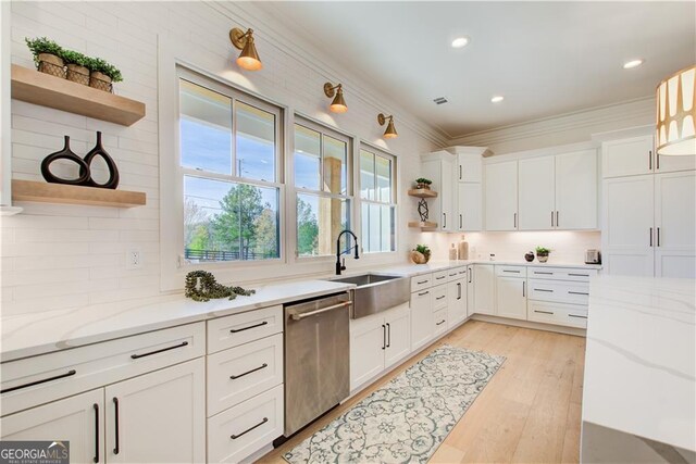 kitchen featuring stainless steel dishwasher, open shelves, white cabinetry, and decorative backsplash