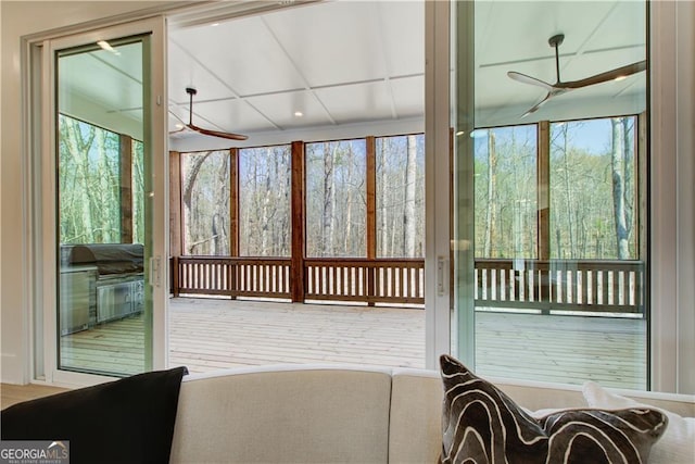 sunroom / solarium featuring a wooden deck