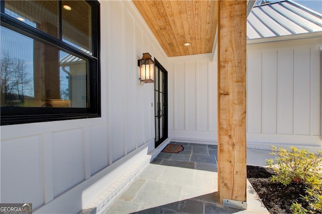 property entrance featuring board and batten siding
