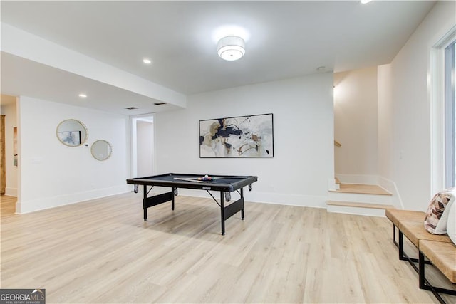 game room featuring baseboards, recessed lighting, and light wood-style flooring