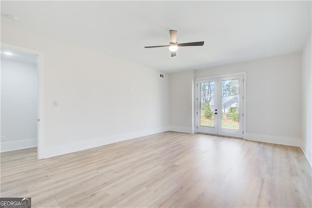 empty room with visible vents, baseboards, ceiling fan, light wood-type flooring, and french doors