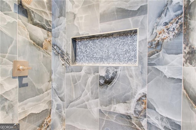 full bath featuring tiled shower