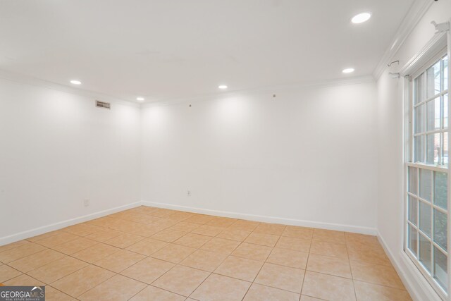 interior space featuring recessed lighting, ornamental molding, and visible vents