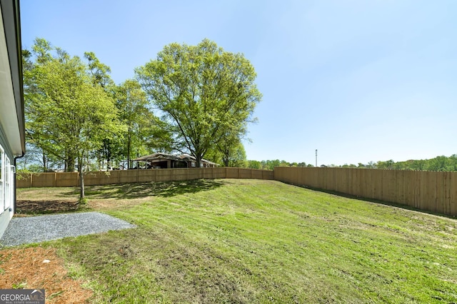 view of yard with a fenced backyard