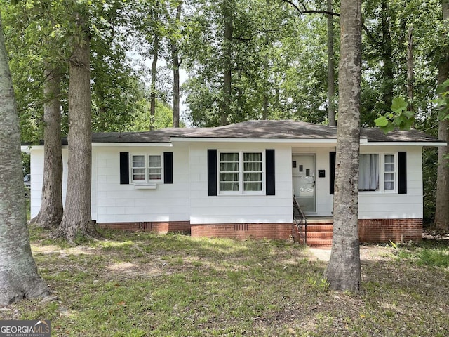 single story home featuring crawl space, a shingled roof, and entry steps