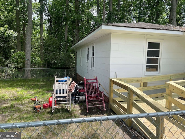 view of property exterior with fence