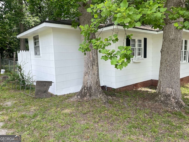 view of property exterior with fence
