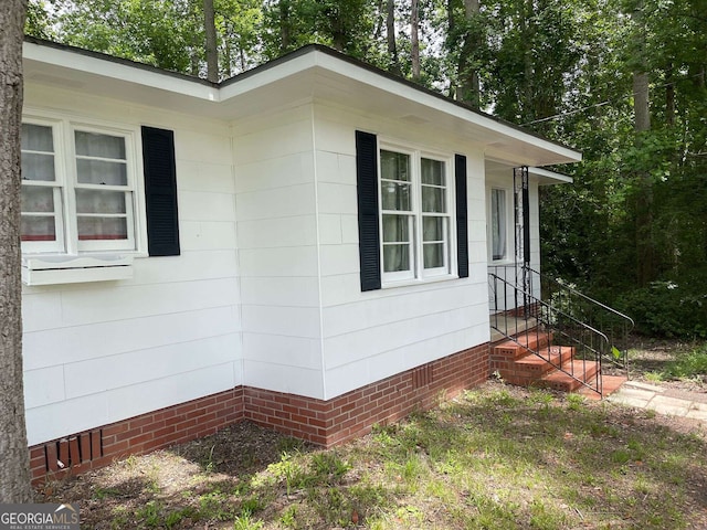 view of property exterior featuring crawl space