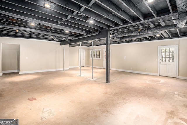 below grade area featuring baseboards