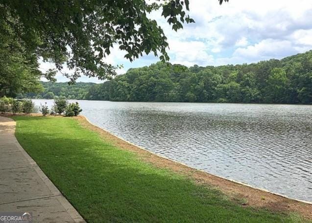 property view of water with a wooded view