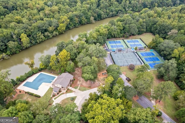 aerial view featuring a water view and a wooded view