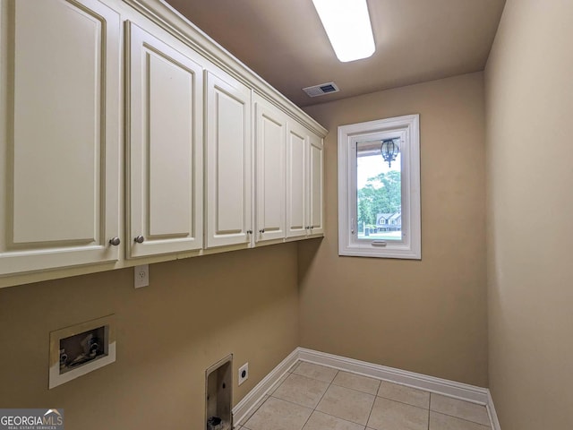 laundry room featuring electric dryer hookup, baseboards, washer hookup, visible vents, and cabinet space